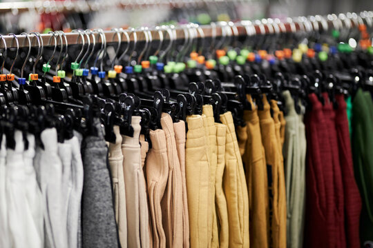 Close-up of a clothes hanger with tags for different European clothing sizes. hangers with clothing sizes, in a clothing store close-up. Shopping concept.