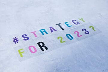 Colorful letters on concrete background saying 'Strategy for 2023