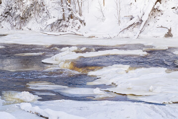 Arctic, Nordic landscape in winter time. Small river with ice in winter time. Cold weather, winter background. beautiful clear day in December
