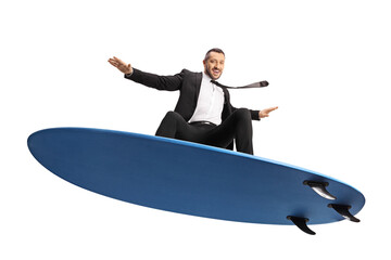 Businessman surfing on a surfboard