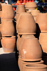 Fototapeta na wymiar Pile of clay vases in a flea market