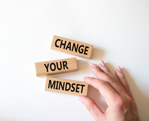 Change your mindset symbol. Concept words Change your mindset on wooden blocks. Businessman hand. Beautiful white background. Business and Change your mindset concept. Copy space.