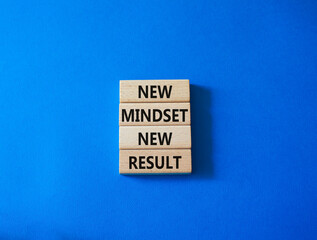 Mindset symbol. Wooden blocks with words New Mindset new Result. Beautiful blue background. Business and New Mindset new Result concept. Copy space.