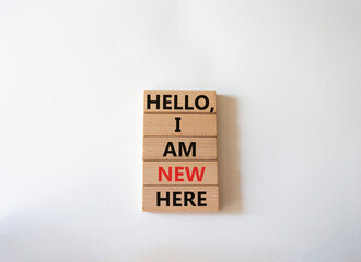 Hello I am new here symbol. Concept words Hello I am new here on wooden blocks. Beautiful white background. Business and Hello I am new here concept. Copy space.