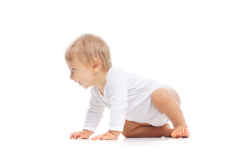 Little, happy and smiling cute baby in the studio. Portrait of a one year old baby. The concept of happiness.
