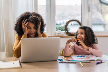 Mother has work related problem and daughter laughs at her reaction
