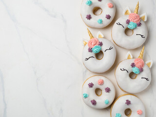 Unicorn donuts with copy space