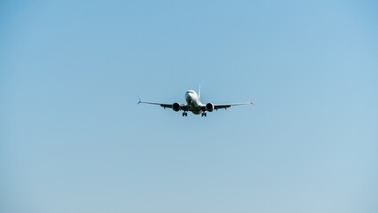 Airplane approaching landing, aircraft landing gear extended - obrazy, fototapety, plakaty