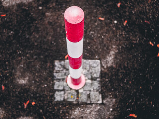 red and white metal post