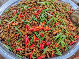 Deep-fried larves in the street market of Siem Reap