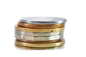 Stack of different Indian rupee coins on white background.