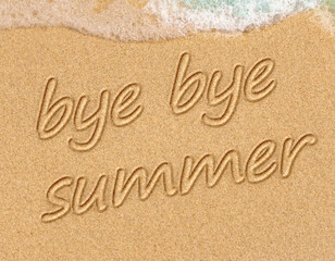 Fototapeta na wymiar closeup of a text bye, bye summer written in it, on the sand of a beach