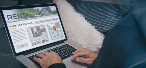 Man reading rental home ads online. Booking vacation in house for rent. Travel, business, concept.