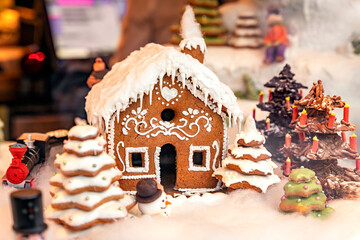 Sweet snowy gingerbread Christmas house, tree and train, snow icing