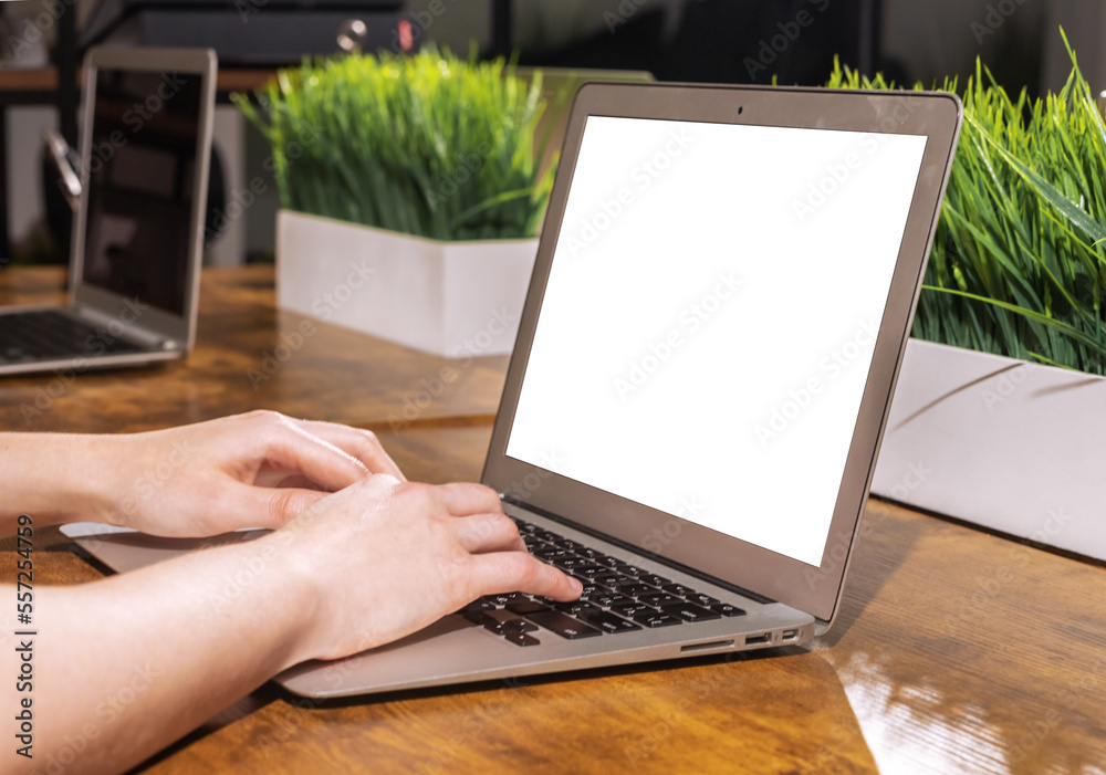 Poster Laptop screen, display mock up, hands typing on computer keyboard, PC with white blank monitor on office desk. High quality photo
