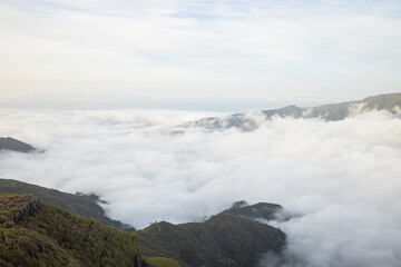 Naklejka premium Great view over the volcanic island of Madeira from the viewpoint Pica da Cana with a towering sea of ​​clouds in the background.