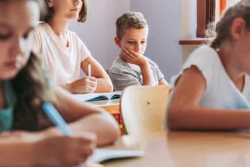 Sad boy in classroom © Photographee.eu