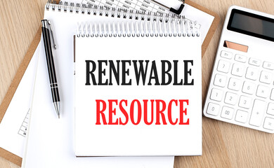 Fototapeta RENEWABLE RESOURCE is written in white notepad near a calculator, clipboard and pen. Business concept obraz