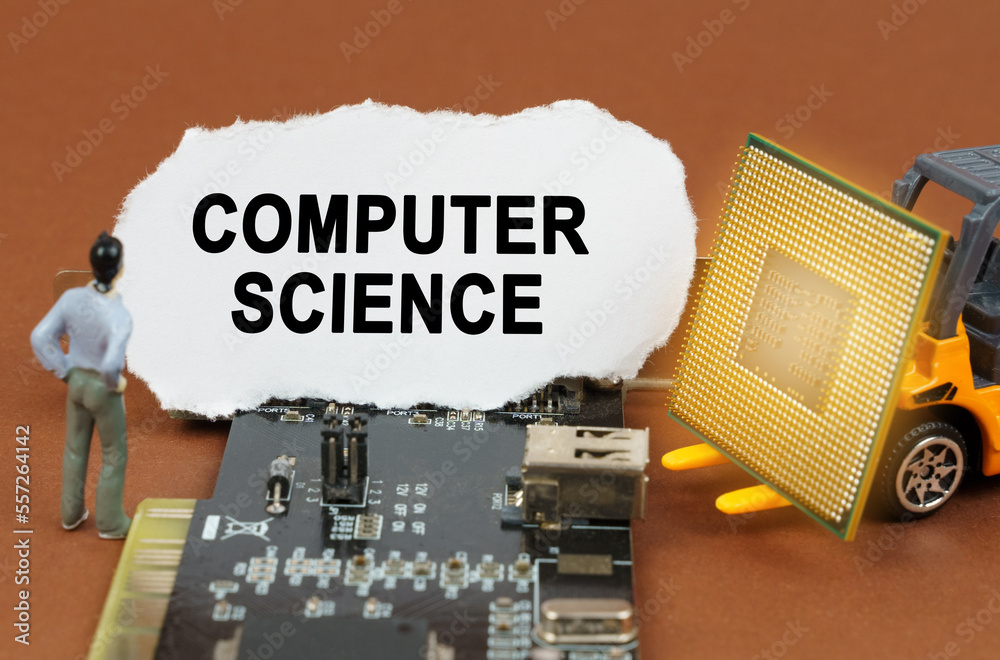 Poster on the board with microcircuits lies a paper plate with the inscription - computer science