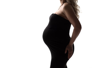 Fototapeta premium banner. without a face. a pregnant woman in a black dress on a white background