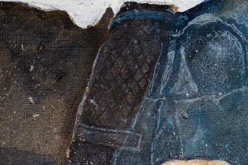 A young man with curly hair holds a handkerchief in his hand. The young man lies on a pillow....