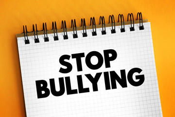 Stop Bullying text on notepad, concept background