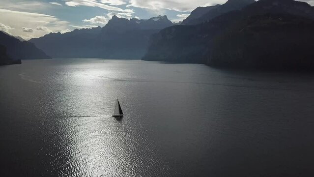 Sailboat on a huge lake in Switzerland Fall Time