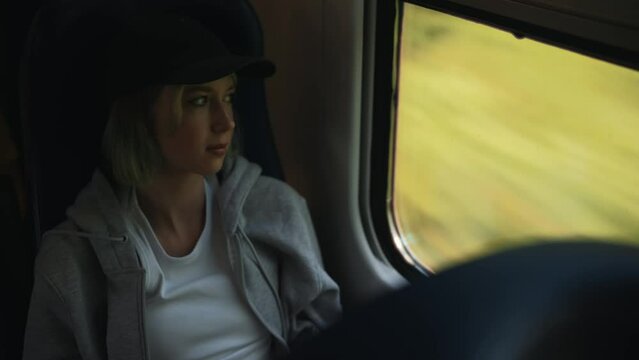 Teenage girl travelling inside the train.
