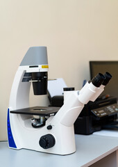 Modern laboratory microscope technologies. Biotechnology professional researching.