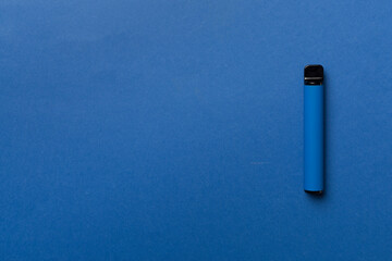 Disposable electronic cigarettes on color background

