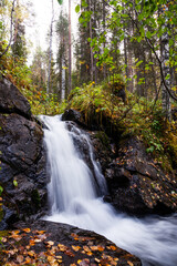 Naklejka premium A small waterfall next to Rytisuo hiking trail in Oulanka National Park, Northern Finland