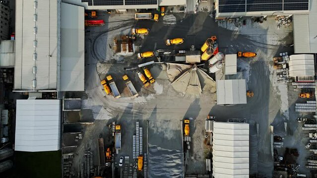Aerial view of construction company site with heavy machinery