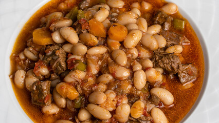 Kuru Fasulye. Traditional Turkish cuisine. Turkish dish. Haricot beans with meat. Top view