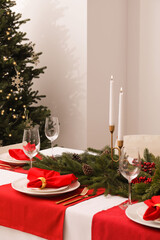 Beautiful table setting with Christmas decor indoors