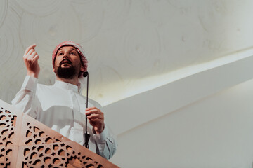Muslims arabic Imam has a speech on friday afternoon prayer in mosque. Muslims have gathered for...