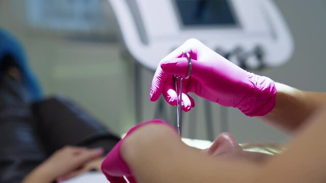 Dentistry gloved hands making operation. Surgery teeth healthcare.