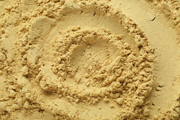 Aromatic mustard powder as background, top view