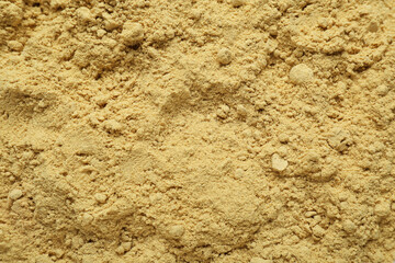 Aromatic mustard powder as background, top view