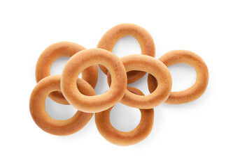 Tasty dry bagels (sushki) isolated on white, top view