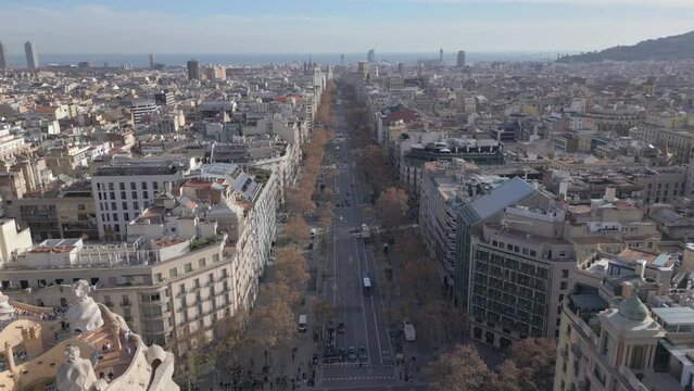 flying backward over Paseo de Gracia in Barcelona Spain
