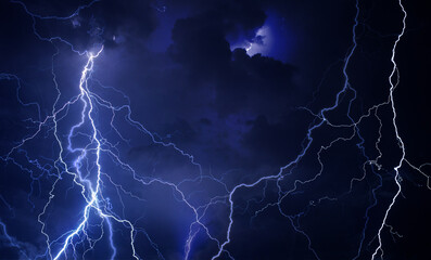 Fork lightning striking down during summer storm