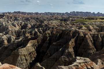 Dry Landscape of badlands National Park Along the Blue Sky