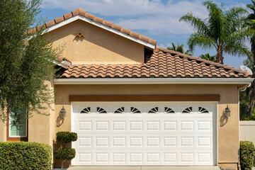 Steel automatic sectional garage door exterior view, single-family residence, Menifee, California,...