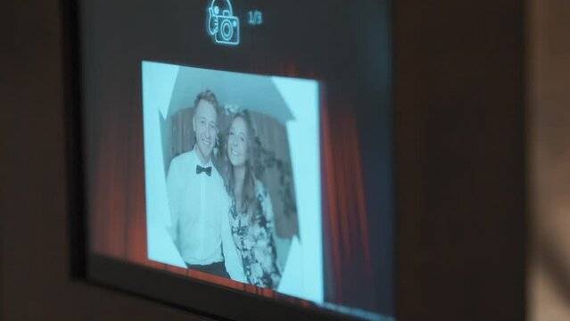 Teen Elegant Couple Posing, Smiling and Having Fun in Photobooth.
