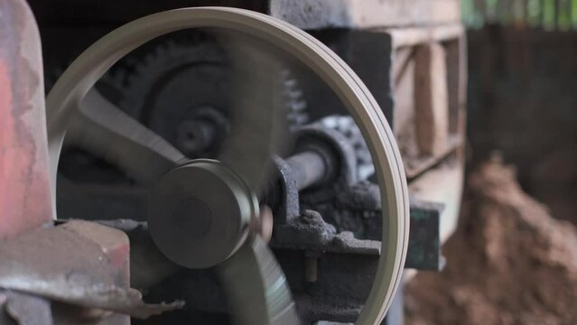 Part of the machine, the toothed wheel rotates rapidly in slow motion