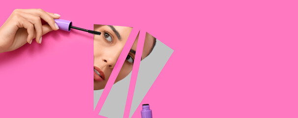 Beautiful young woman with mascara visible through cut pink paper. Banner for design