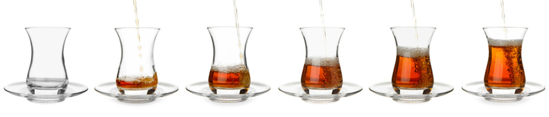 Process of pouring of tasty Turkish tea into glass cup on white background