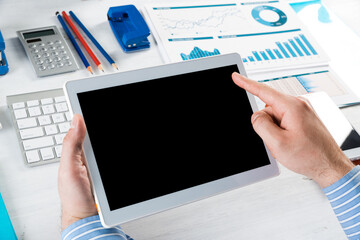 businessman with a tablet, works in the office