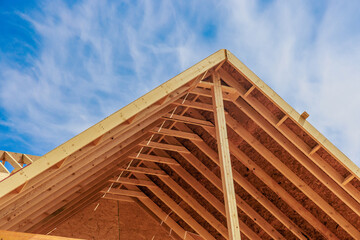Fototapeta Wooden roof structure viewed from above. Construction of new house. obraz