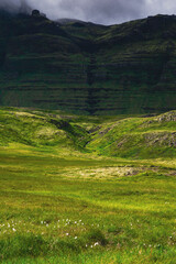 Obraz premium Beautiful nordic landscapes with mountains hills and waterfalls. Cloudy day